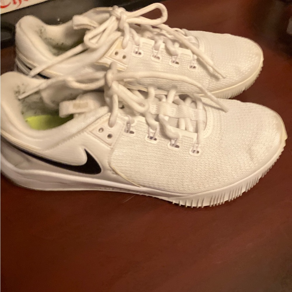 Nike White Athletic Shoes with Black Swoosh